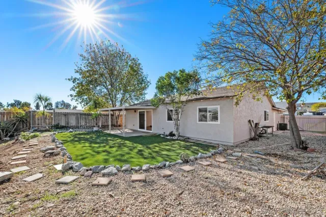 a house view with a backyard space