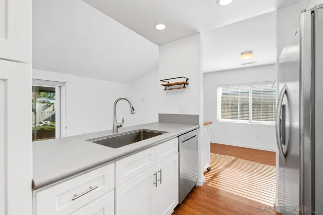 a kitchen with a sink and cabinets