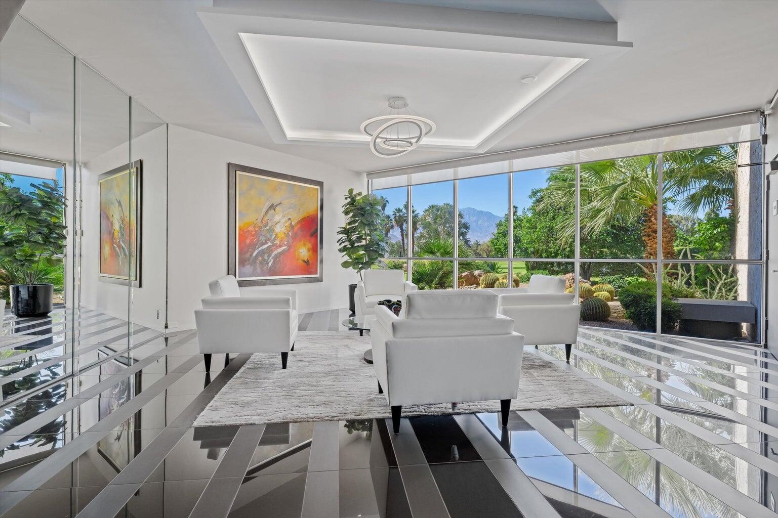 899 Island Drive, Unit 304 Rancho Mirage, CA 92270 - Photo 25 of 30 a living room with large window and furniture