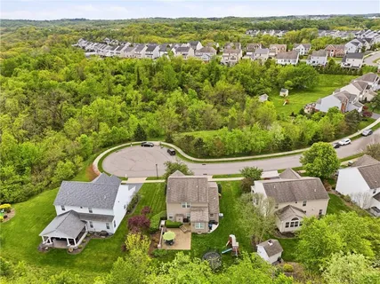 an aerial view of a house with garden space and outdoor space