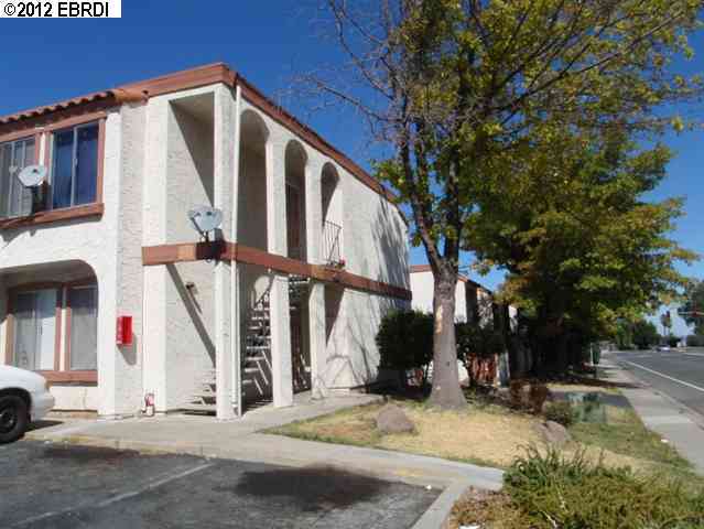 4116 Loveridge Road Pittsburg, CA 94565 - Photo 1 of 1 a view of street along with house and trees