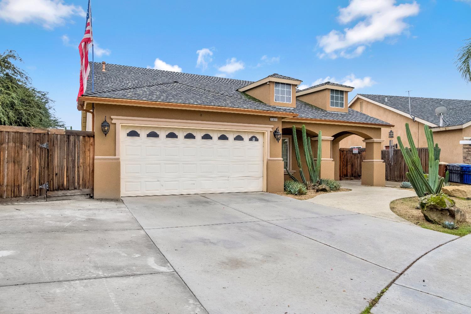 1571 Lemon Avenue Madera, CA 93637 - Photo 2 of 38 a front view of a house with garden