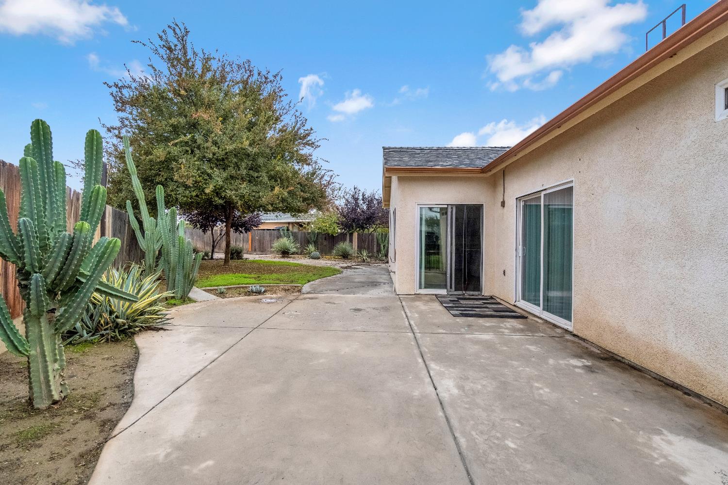 1571 Lemon Avenue Madera, CA 93637 - Photo 28 of 38 a view of a backyard with plants and a patio