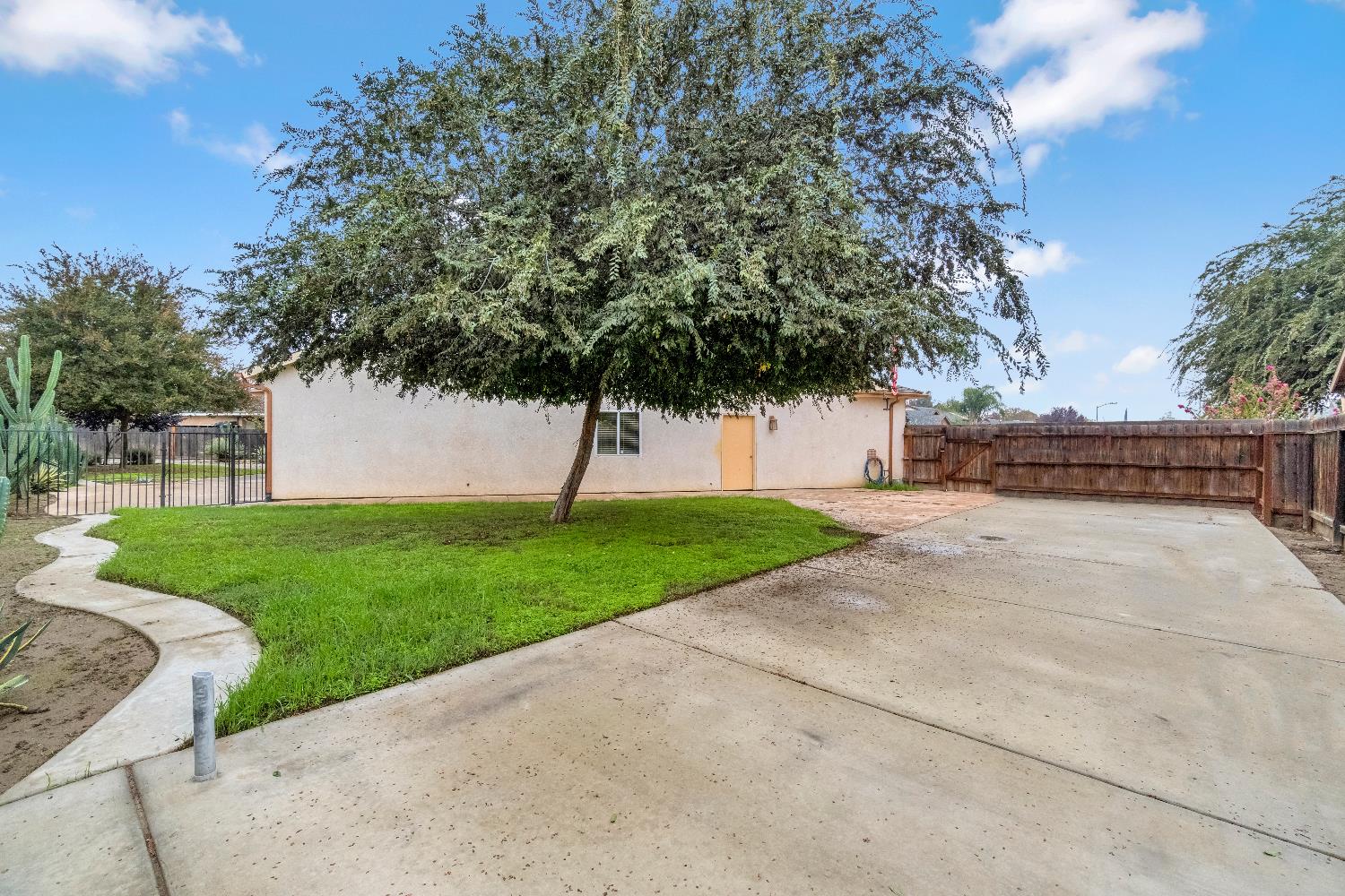 1571 Lemon Avenue Madera, CA 93637 - Photo 31 of 38 a view of a backyard with green space