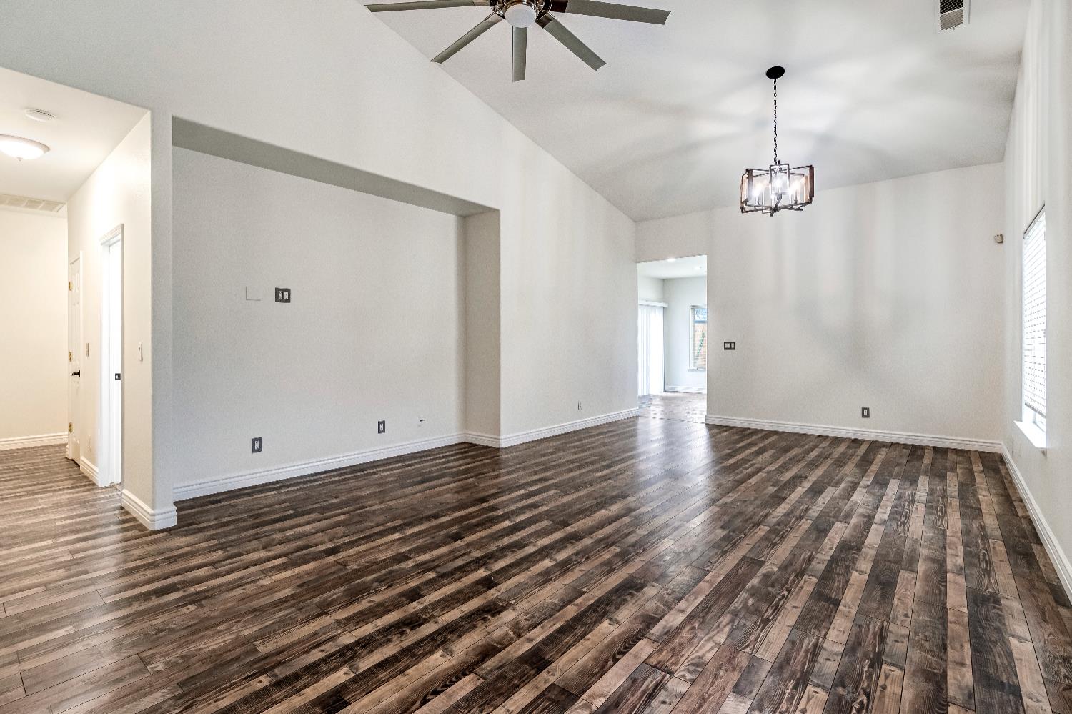 1571 Lemon Avenue Madera, CA 93637 - Photo 6 of 38 a view of a room with wooden floor and white walls