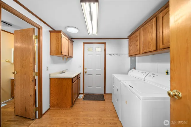 a view of a storage & utility room with a sink