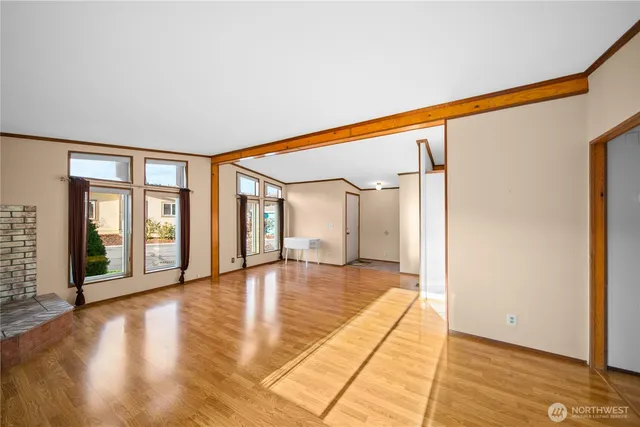 a view of an entryway with wooden floor