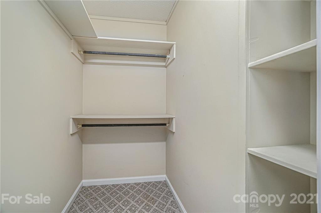4325 Flowes Store Road Concord, NC 28025 - Photo 12 of 31 a view of an empty walk in closet