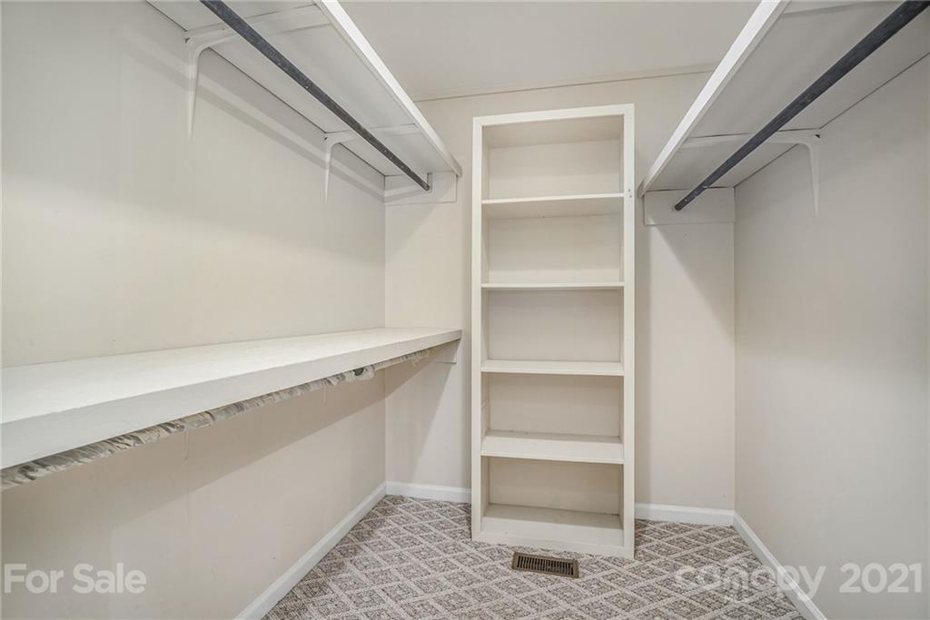 4325 Flowes Store Road Concord, NC 28025 - Photo 17 of 31 a view of an empty walk in closet