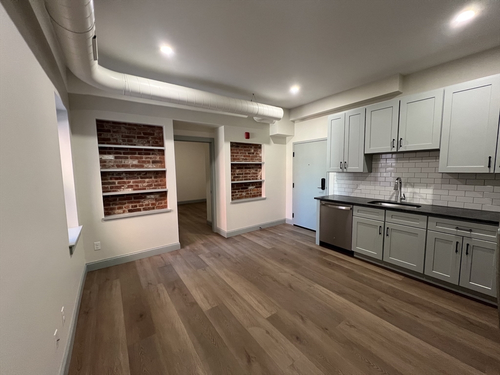 160 Seabury Street, Unit 6 Fall River, MA 02720 - Photo 1 of 10 a kitchen with stainless steel appliances granite countertop a stove a sink and a refrigerator