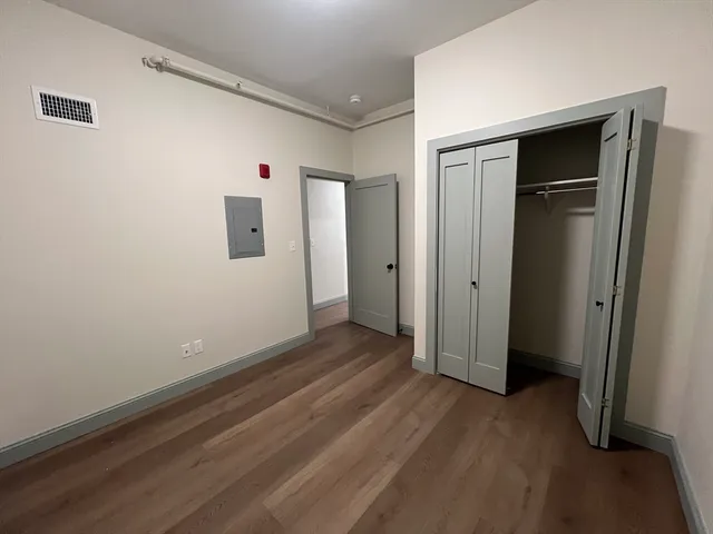 a view of a livingroom with wooden floor