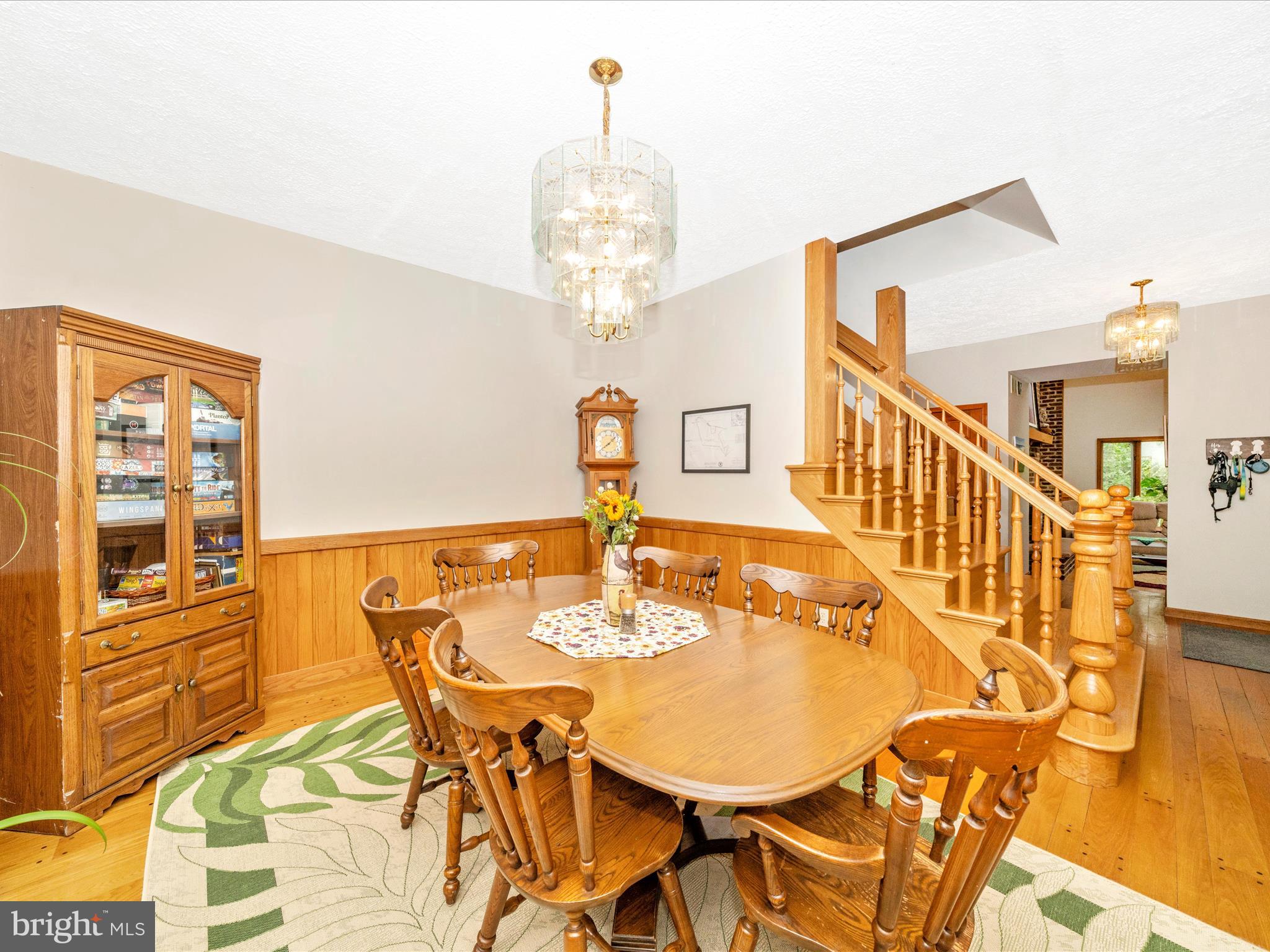17879 Harbaugh Valley Road Sabillasville, MD 21780 - Photo 18 of 64 a view of a dining room with furniture and a chandelier