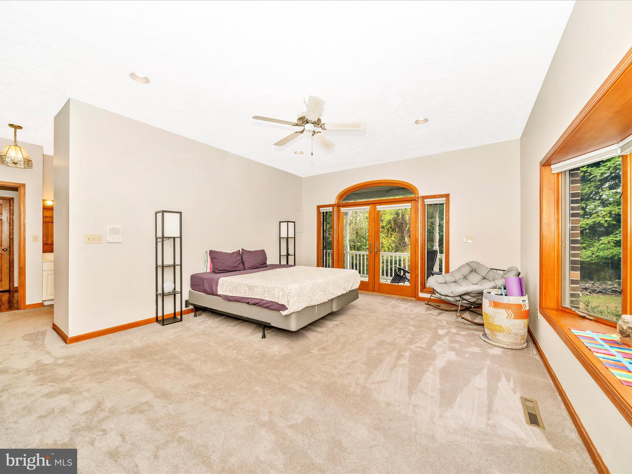 17879 Harbaugh Valley Road Sabillasville, MD 21780 - Photo 25 of 64 a spacious bedroom with a bed and a large window