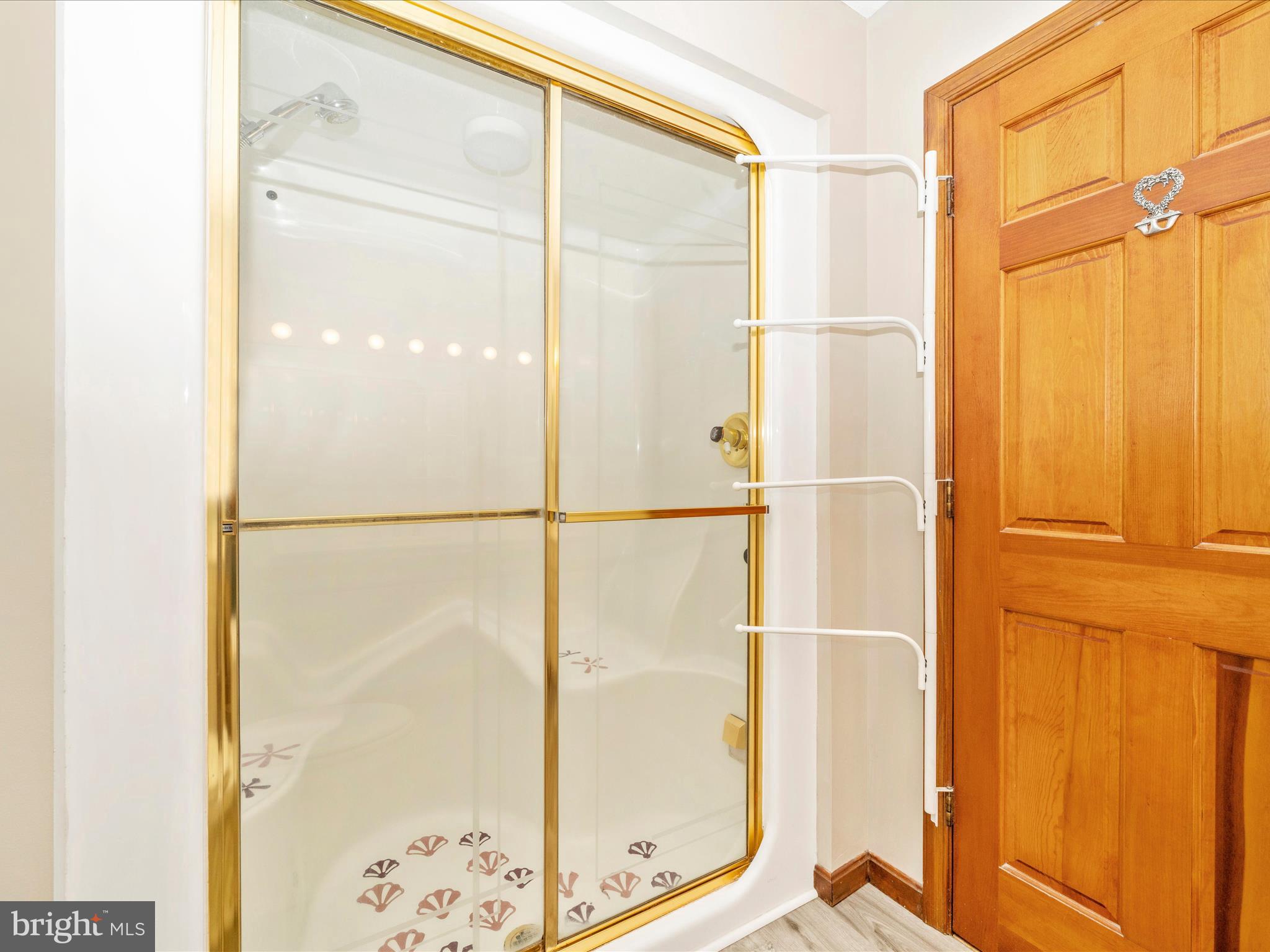 17879 Harbaugh Valley Road Sabillasville, MD 21780 - Photo 30 of 64 a bathroom with a glass shower door