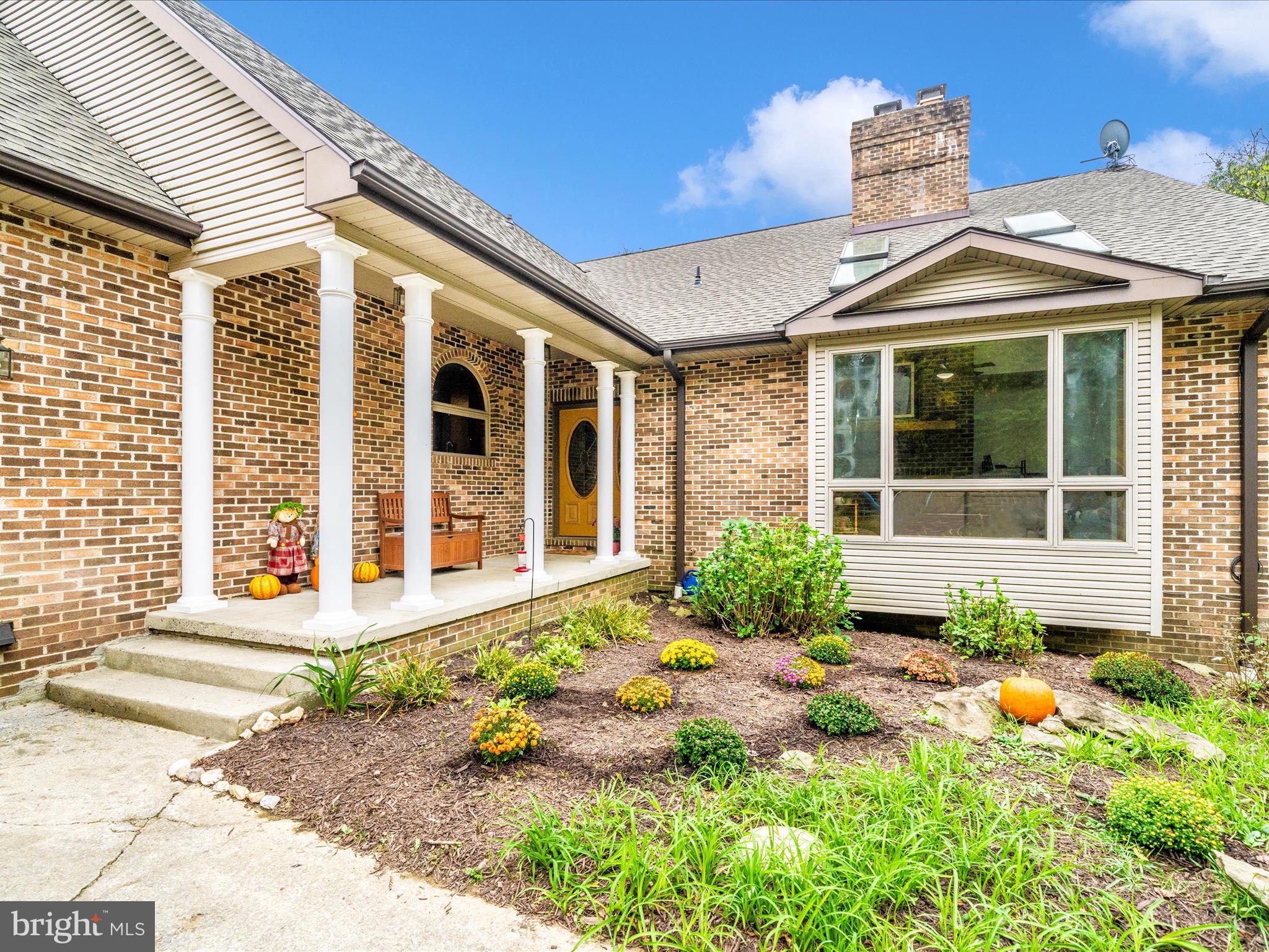 17879 Harbaugh Valley Road Sabillasville, MD 21780 - Photo 3 of 64 a front view of a house with a yard outdoor seating and barbeque oven