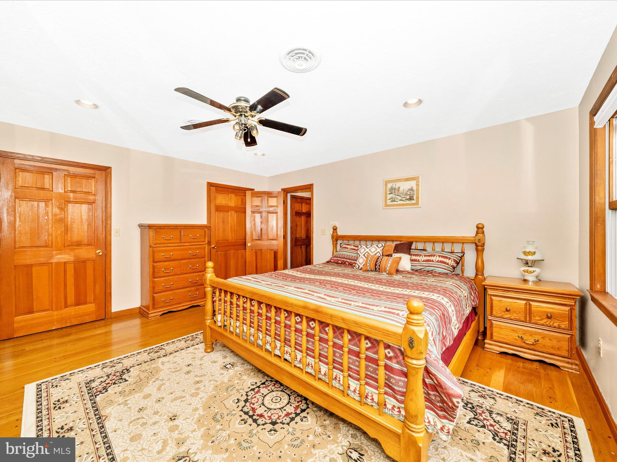 17879 Harbaugh Valley Road Sabillasville, MD 21780 - Photo 33 of 64 a bed room with a bed and a chandelier