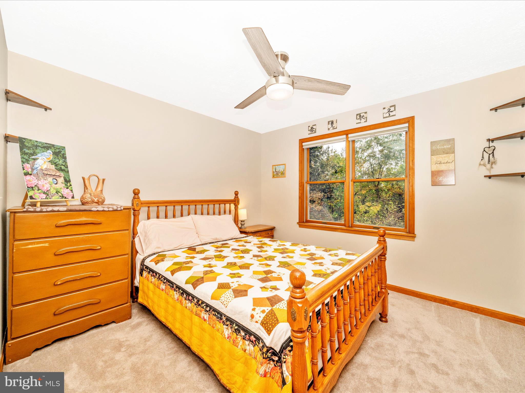 17879 Harbaugh Valley Road Sabillasville, MD 21780 - Photo 34 of 64 a bed sitting in a bedroom next to a window