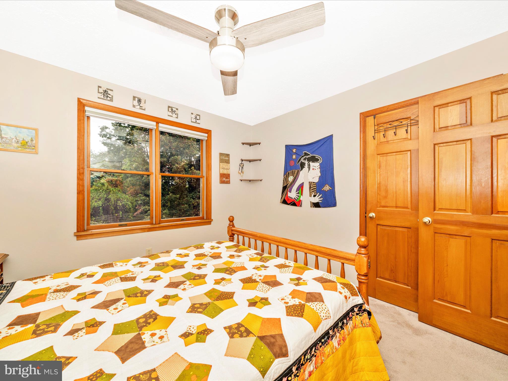 17879 Harbaugh Valley Road Sabillasville, MD 21780 - Photo 35 of 64 a bedroom with a bed and a window