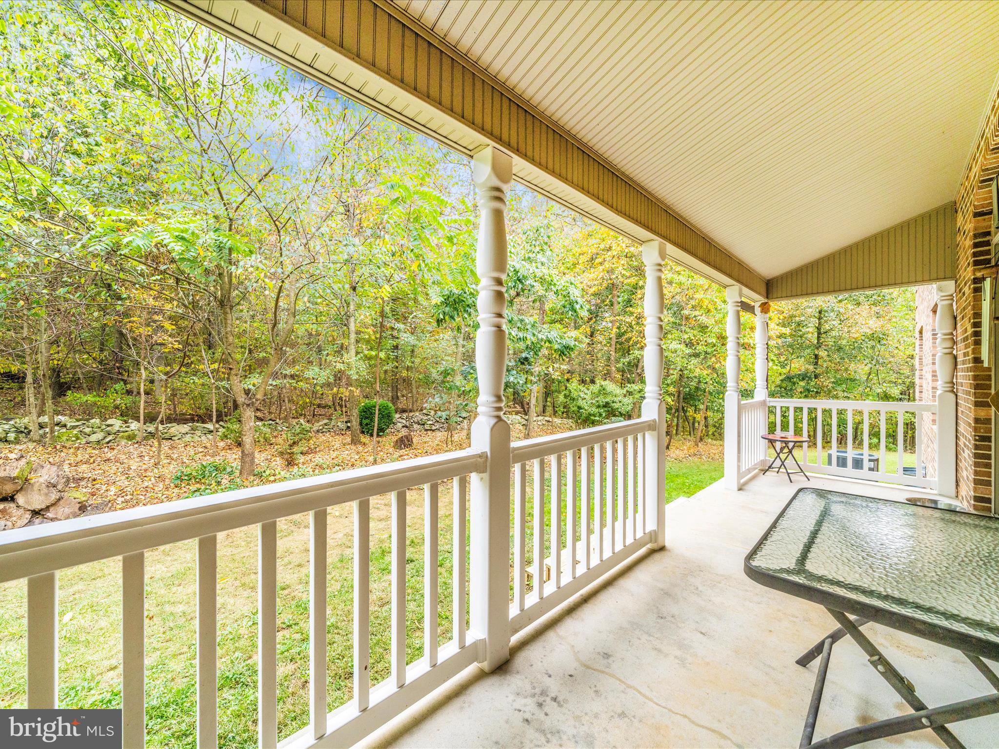 17879 Harbaugh Valley Road Sabillasville, MD 21780 - Photo 53 of 64 Side Porch with Woodland and Stonewall views