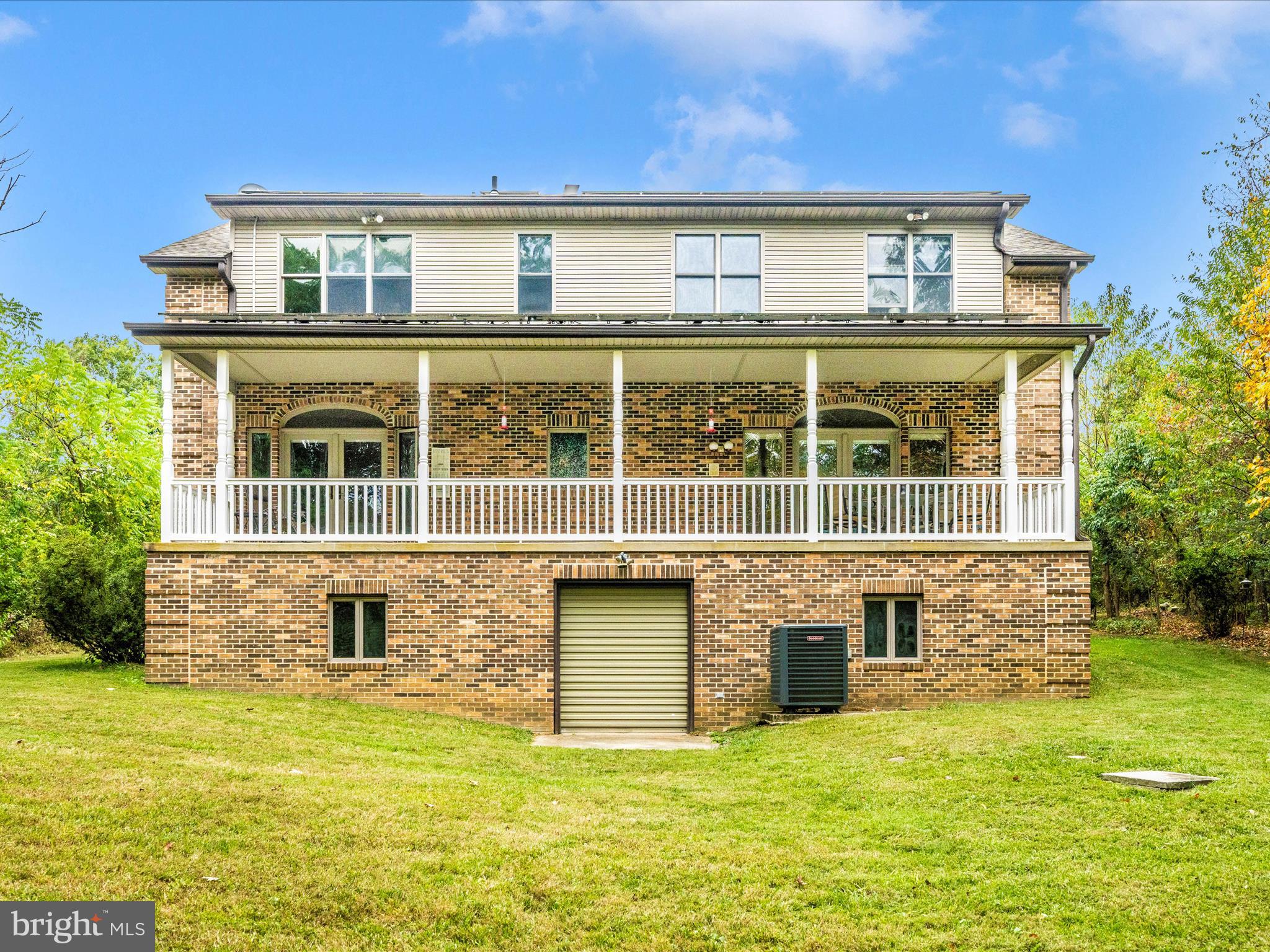 17879 Harbaugh Valley Road Sabillasville, MD 21780 - Photo 54 of 64 Exterior Back with Lower Level garage door Egress
