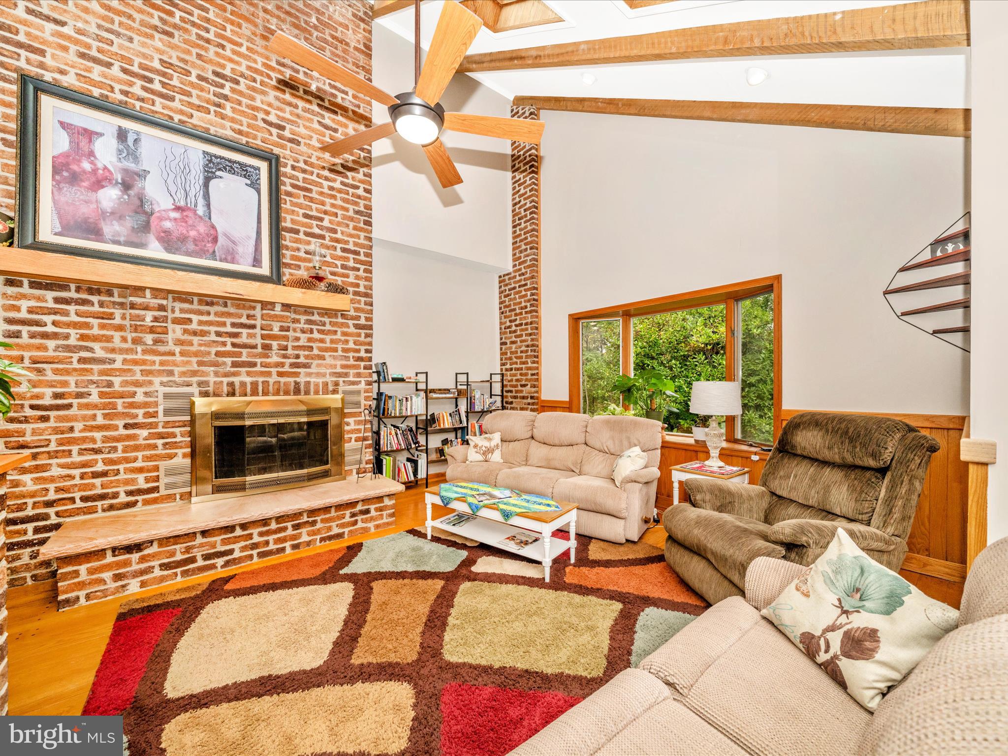 17879 Harbaugh Valley Road Sabillasville, MD 21780 - Photo 7 of 64 a living room with furniture and a fireplace