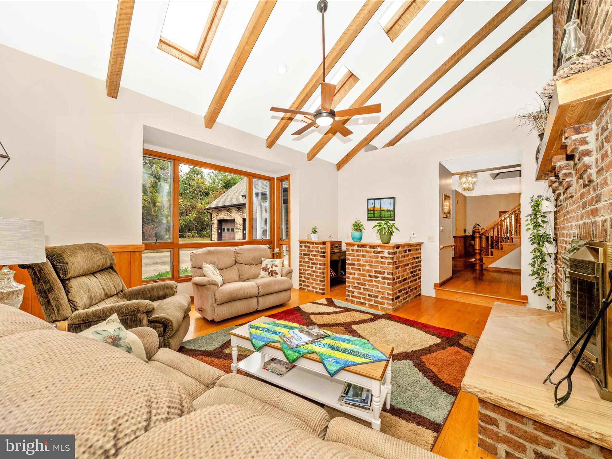 17879 Harbaugh Valley Road Sabillasville, MD 21780 - Photo 8 of 64 a living room with lots of furniture and a open kitchen view