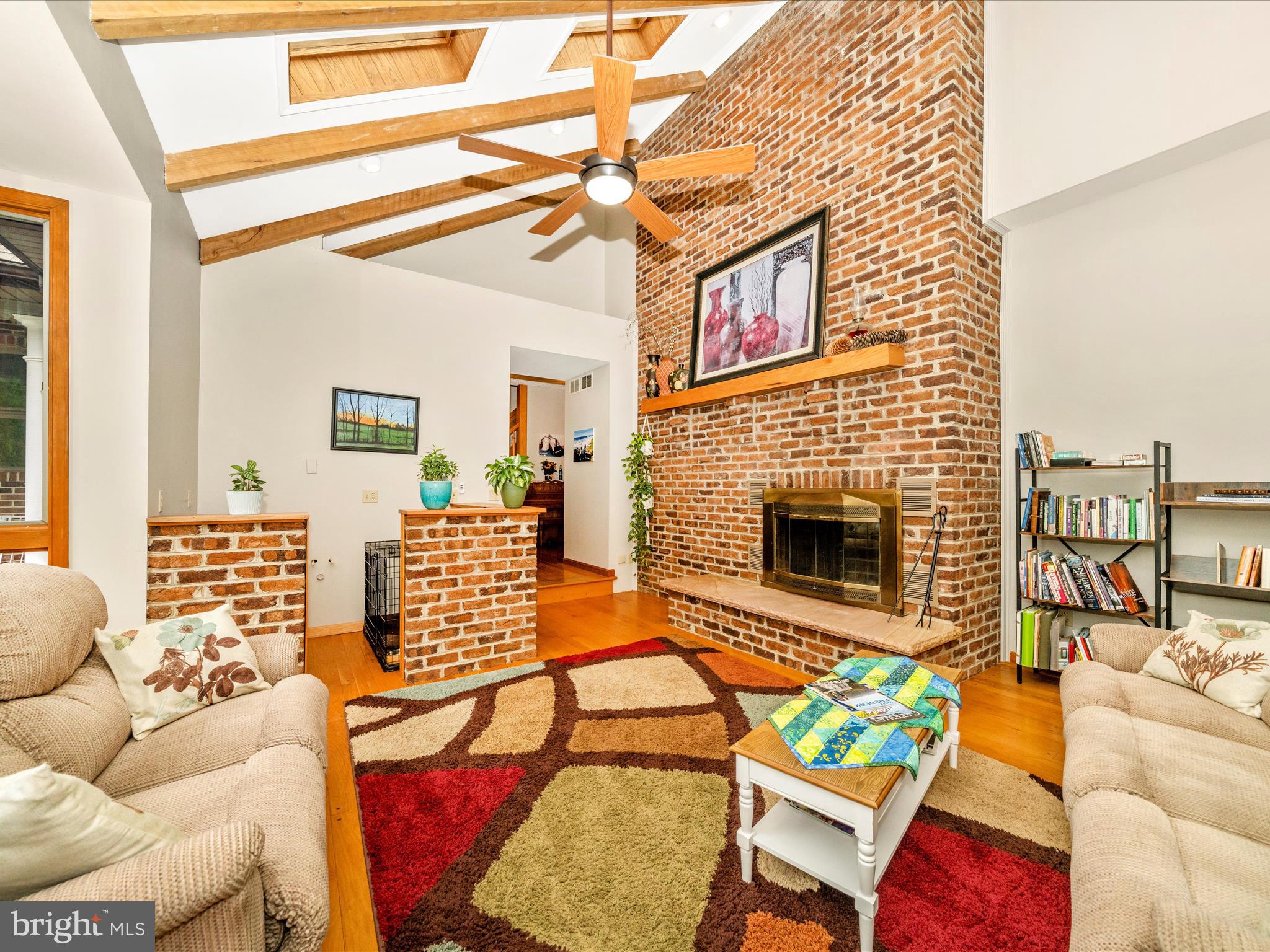 17879 Harbaugh Valley Road Sabillasville, MD 21780 - Photo 9 of 64 a living room with furniture a fireplace and a flat screen tv