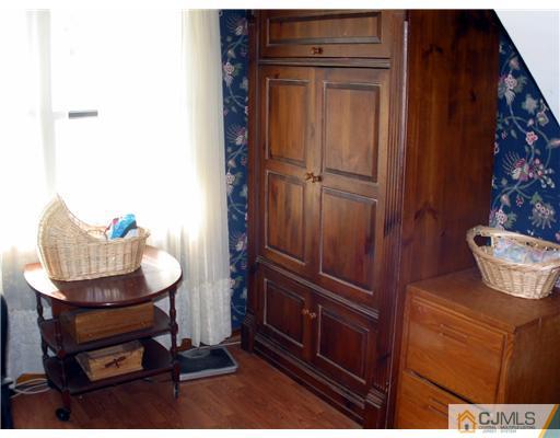 1232 West Farms Road Howell, NJ 07731 - Photo 12 of 23 a living room with furniture and a potted plant