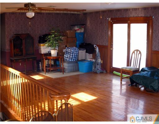 1232 West Farms Road Howell, NJ 07731 - Photo 13 of 23 a living room with furniture and wooden floor
