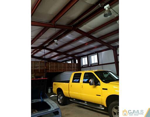 1232 West Farms Road Howell, NJ 07731 - Photo 22 of 23 a view of a car in garage