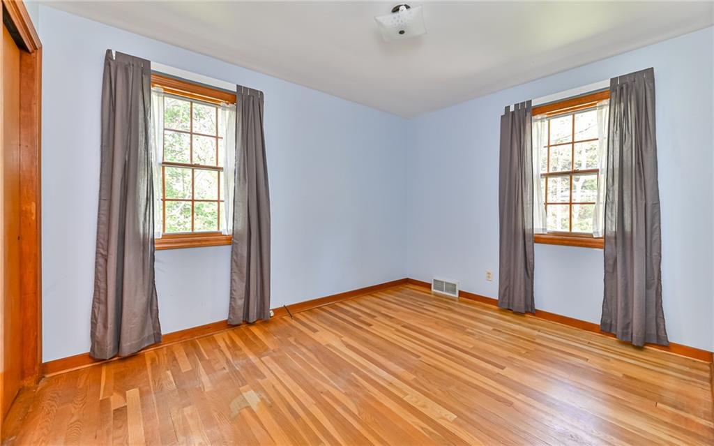 118 Lower Arrowhead Road Pittsburgh, PA 15237 - Photo 12 of 25 a view of empty room with wooden floor and fan