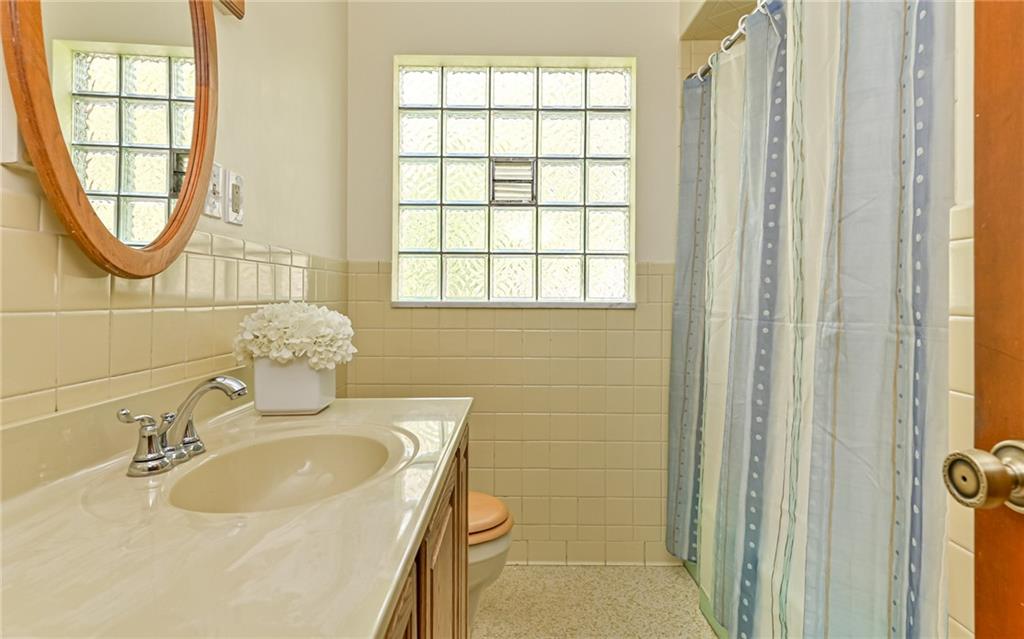 118 Lower Arrowhead Road Pittsburgh, PA 15237 - Photo 13 of 25 a bathroom with a sink and a mirror