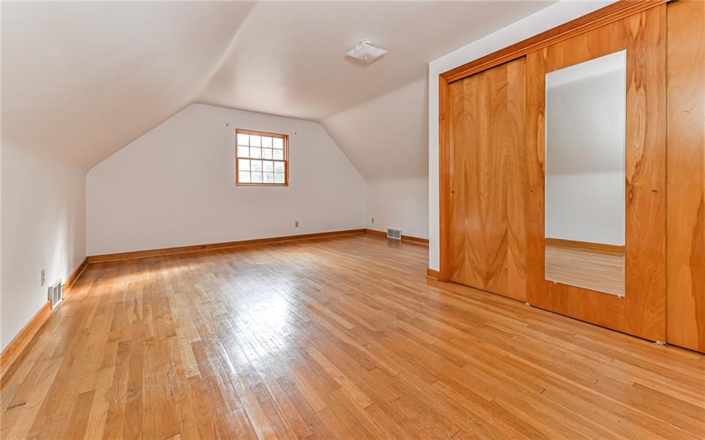 118 Lower Arrowhead Road Pittsburgh, PA 15237 - Photo 15 of 25 an empty room with wooden floor and windows