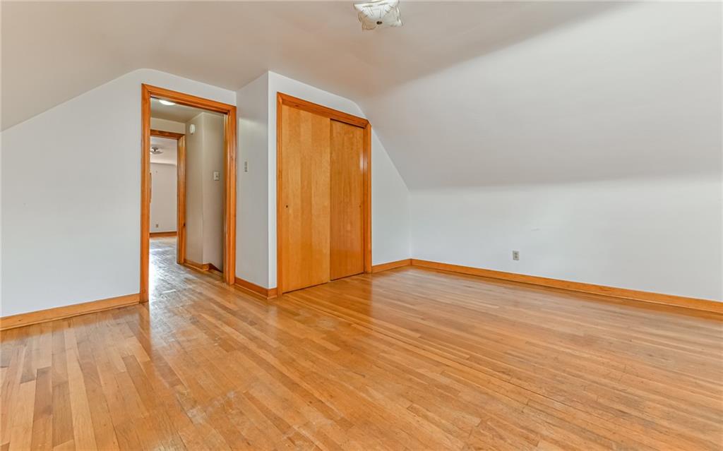 118 Lower Arrowhead Road Pittsburgh, PA 15237 - Photo 17 of 25 a view of an empty room with wooden floor and a window