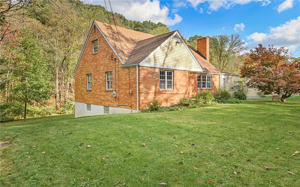 118 Lower Arrowhead Road Pittsburgh, PA 15237 - Photo 22 of 25 a view of a house with a yard