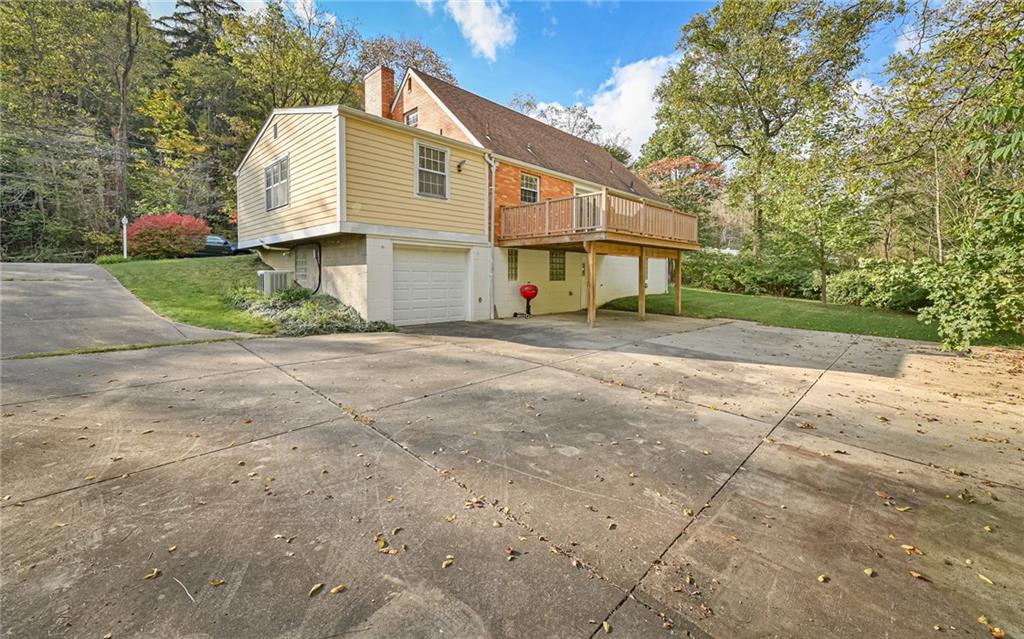 118 Lower Arrowhead Road Pittsburgh, PA 15237 - Photo 25 of 25 a front view of a house with a yard and garage