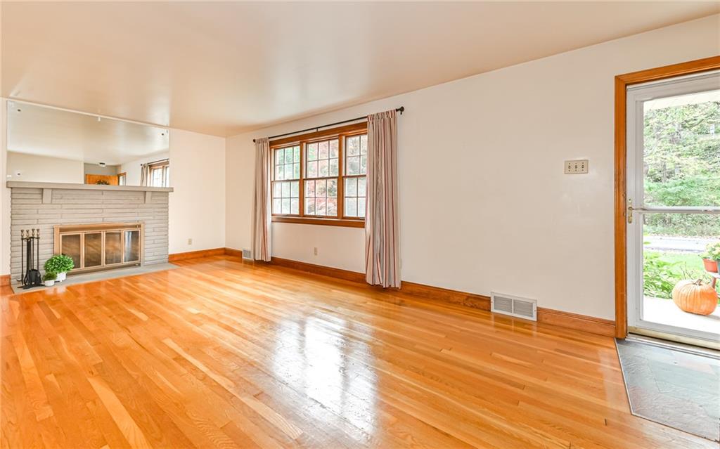 118 Lower Arrowhead Road Pittsburgh, PA 15237 - Photo 4 of 25 a view of empty room with wooden floor and fan
