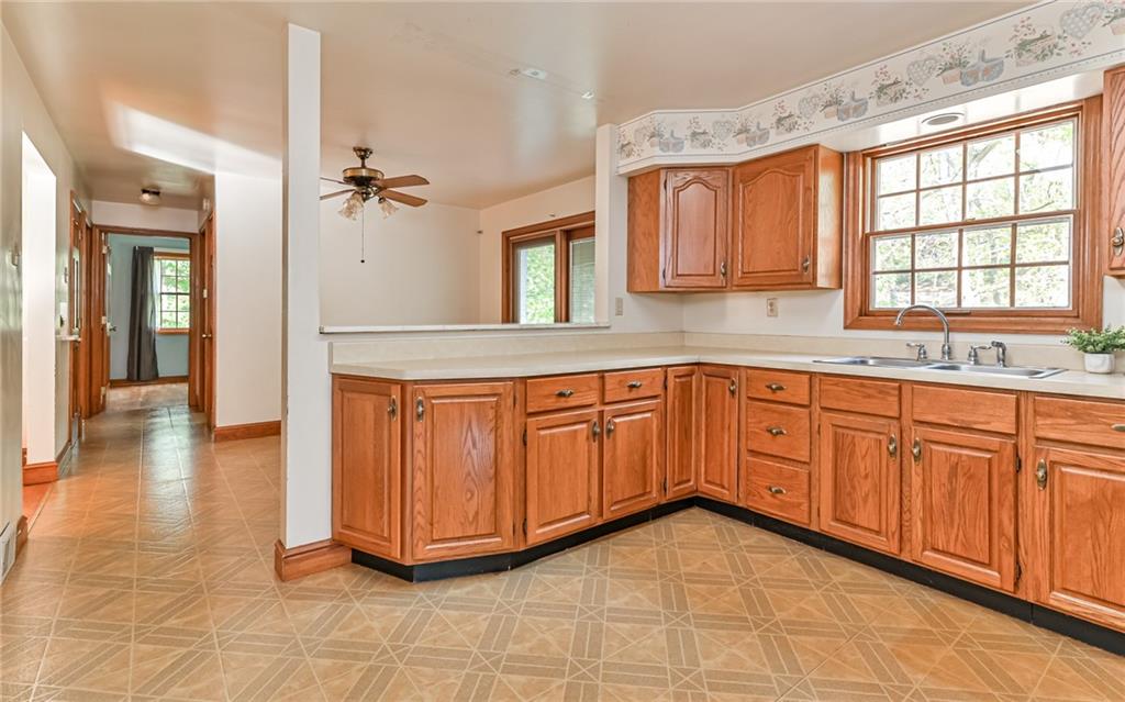 118 Lower Arrowhead Road Pittsburgh, PA 15237 - Photo 8 of 25 a kitchen with stainless steel appliances granite countertop a stove a sink and a refrigerator