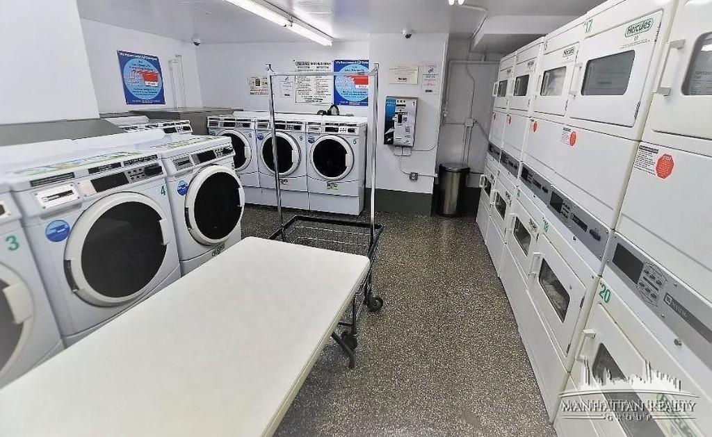 145 4th Avenue, Unit 9F Manhattan, NY 10003 - Photo 3 of 3 a utility room with dryer and washer