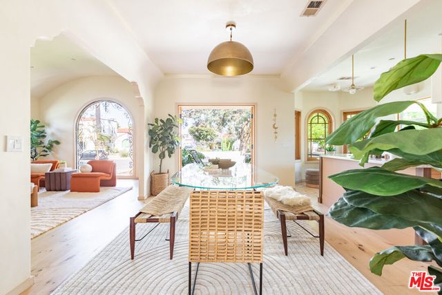 a kitchen with stainless steel appliances granite countertop a stove and cabinets