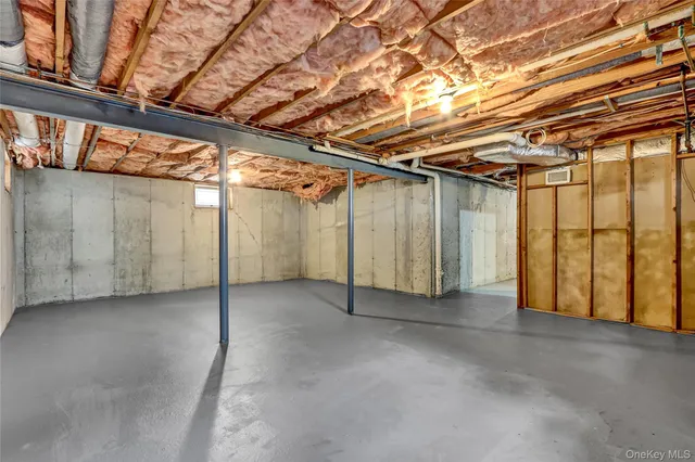 a bedroom with a bed and a table