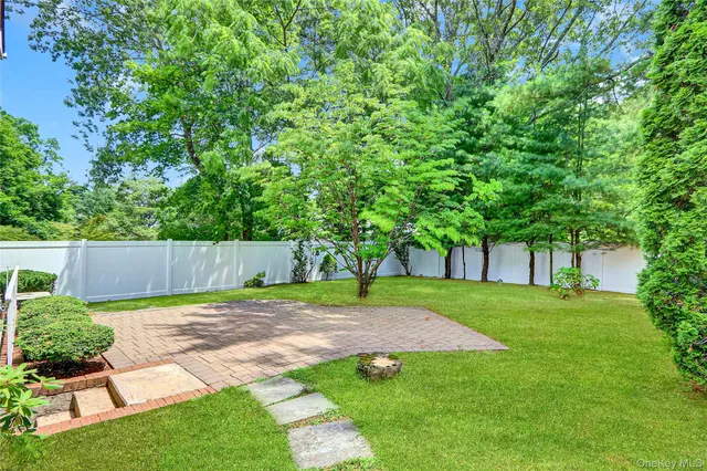 a view of a backyard with a swing