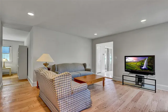 a view of a kitchen with a sink a fireplace and a window
