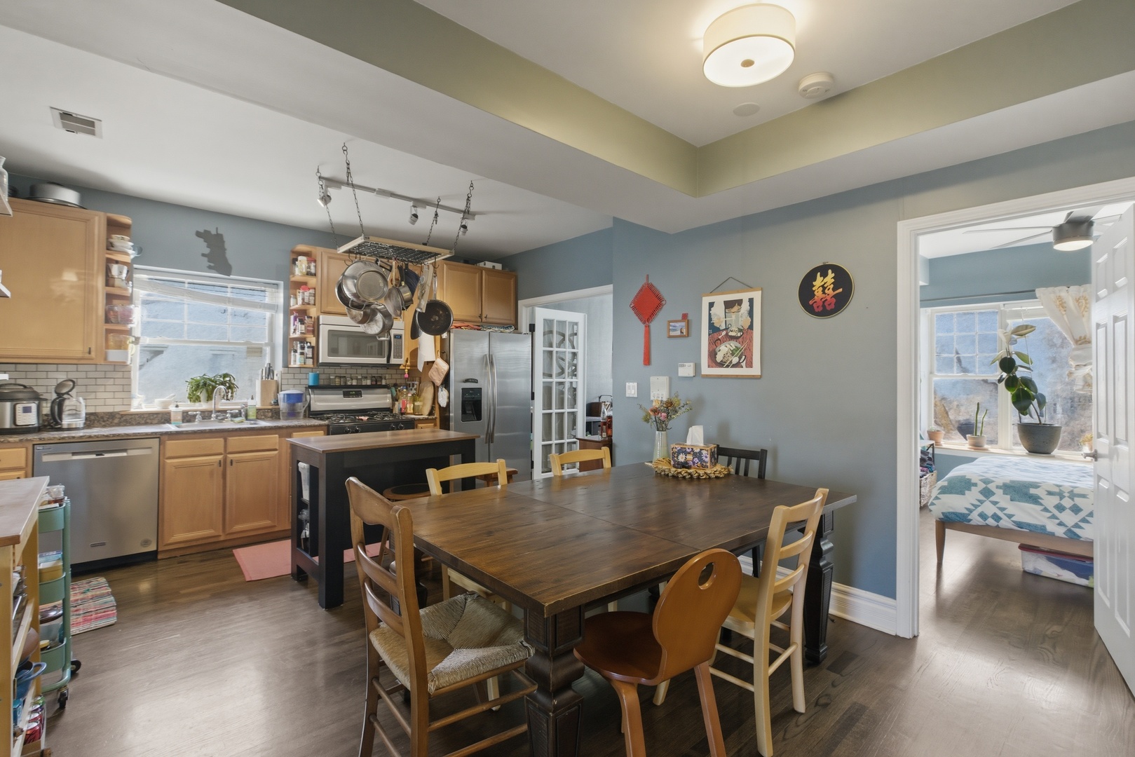 2544 West George Street, Unit 1 Chicago, IL 60618 - Photo 4 of 11 a view of a dining room with furniture and wooden floor