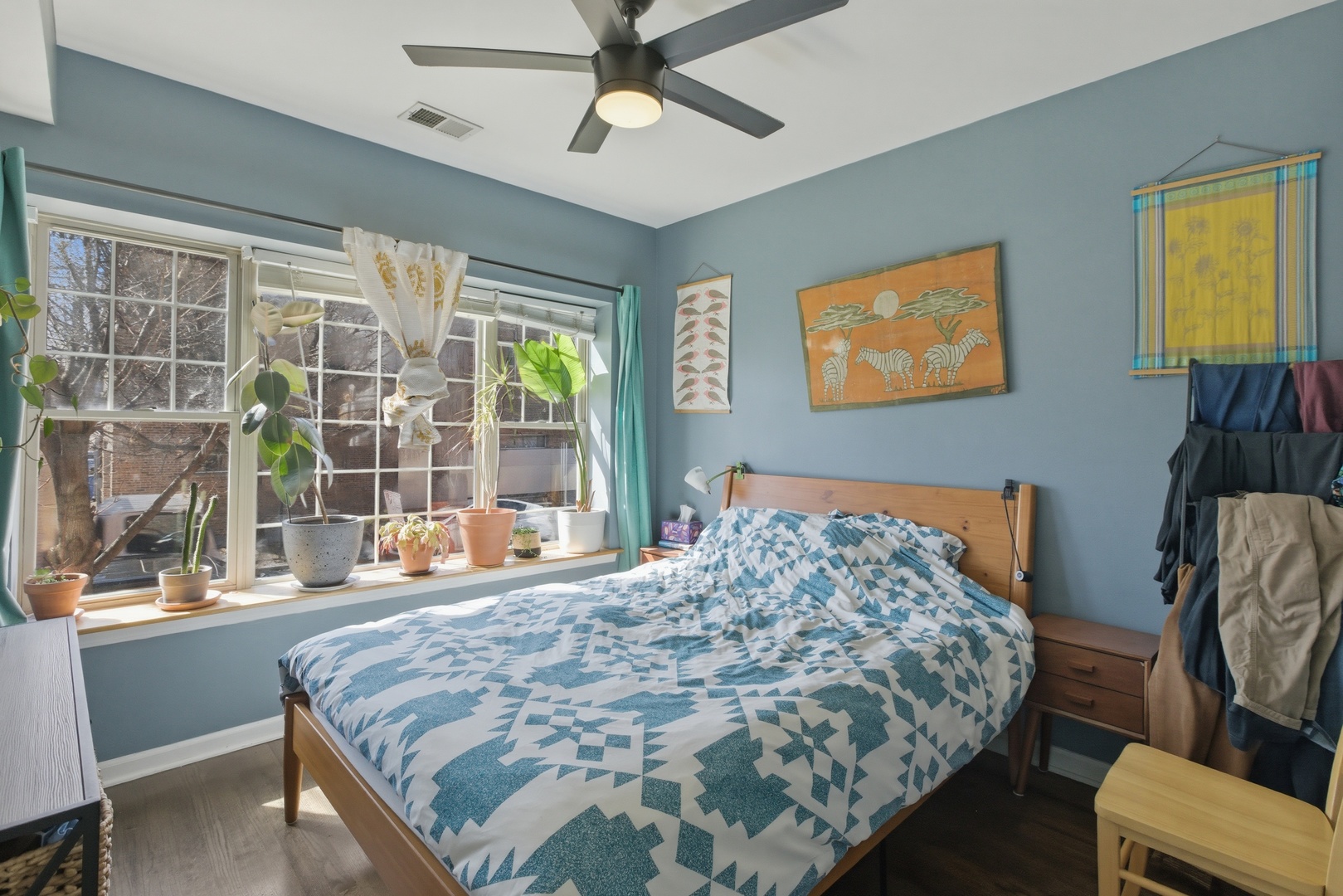 2544 West George Street, Unit 1 Chicago, IL 60618 - Photo 7 of 11 a bed sitting in a bedroom next to a window