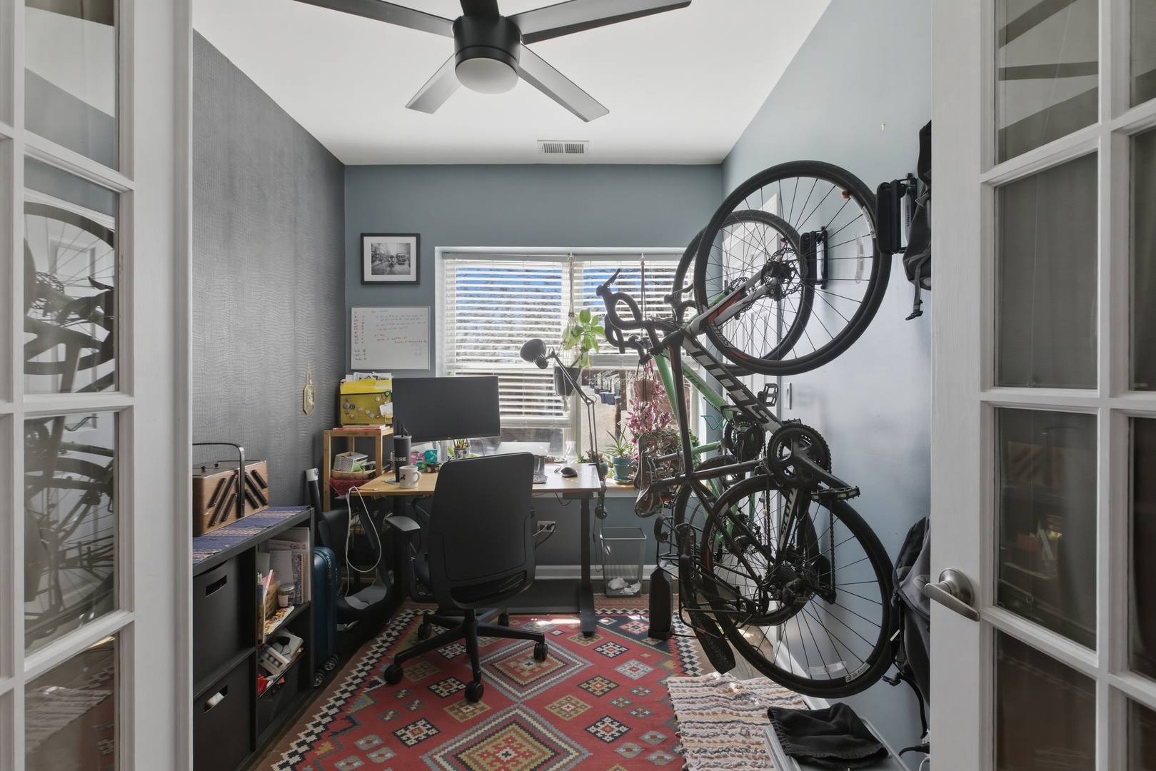 2544 West George Street, Unit 1 Chicago, IL 60618 - Photo 8 of 11 a view of a workspace with furniture gym equipment and windows
