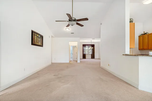 a view of an empty room with a fireplace