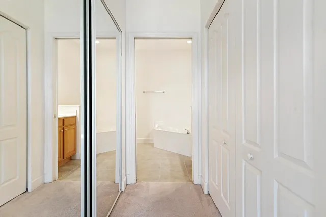 a spacious bathroom with a bathtub and a sink