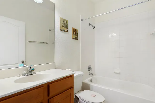 a bathroom with a sink a toilet and a bathtub