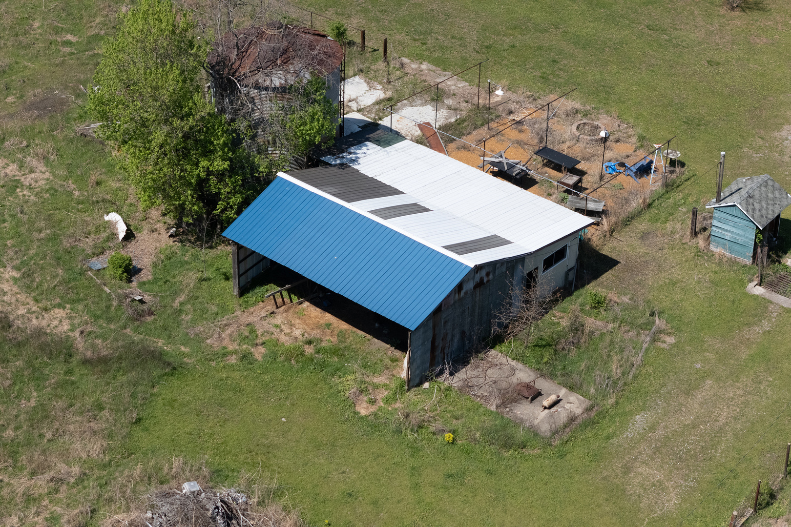 13849 Mustang Road Marion, IL 62959 - Photo 7 of 13 a house with tall trees in front of it
